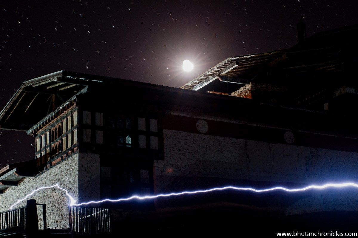 A crescent moon shines above the main temple