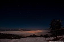 Thimphu glowing from under the clouds
